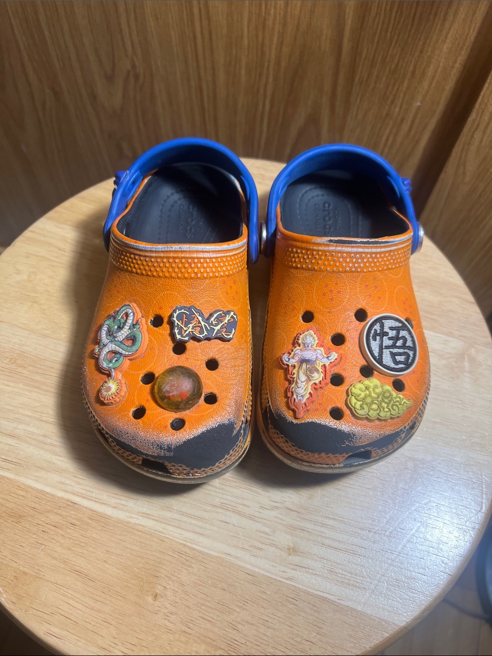CROCS Kids Orange Clog Sandals with Blue Heel Strap and Character Charms
